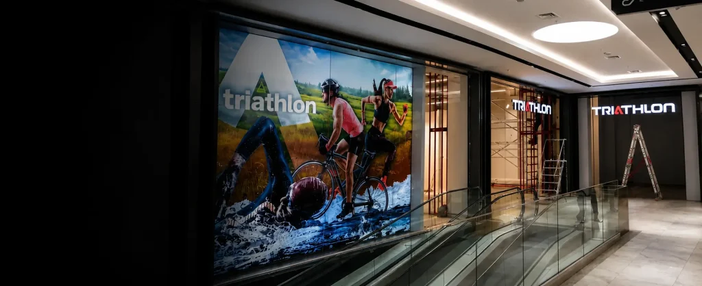 Triathlon shopping mall signage and lightbox installation